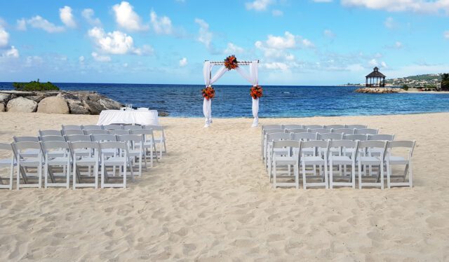 Secrets St. James Montego Bay beach wedding ceremony setup.